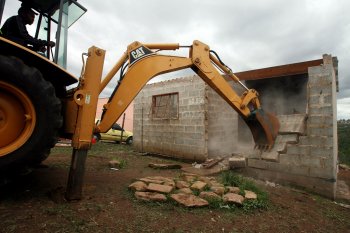 Tears as Government bulldozers flatten houses